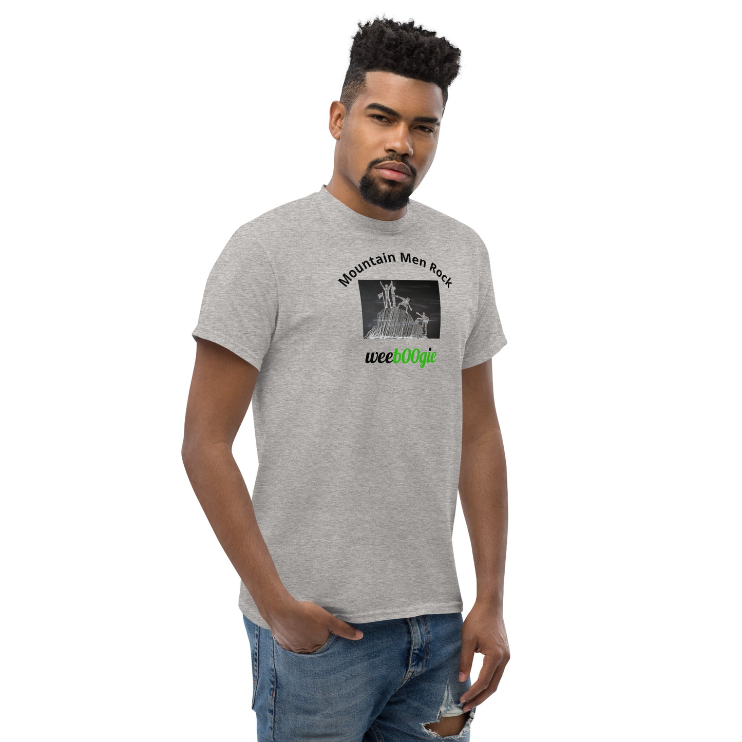 Unisex t-shirt with 'Mountain Men Rock' slogan, styled for outdoor adventures and dance challenges – set against a bold, mountainous backdrop.