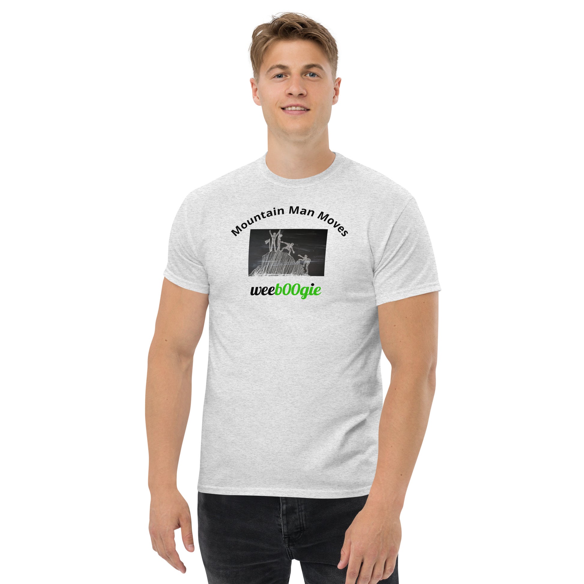 Unisex t-shirt with 'Mountain Man Moves' slogan, styled for outdoor adventures and dance challenges – set against a bold, mountainous backdrop.