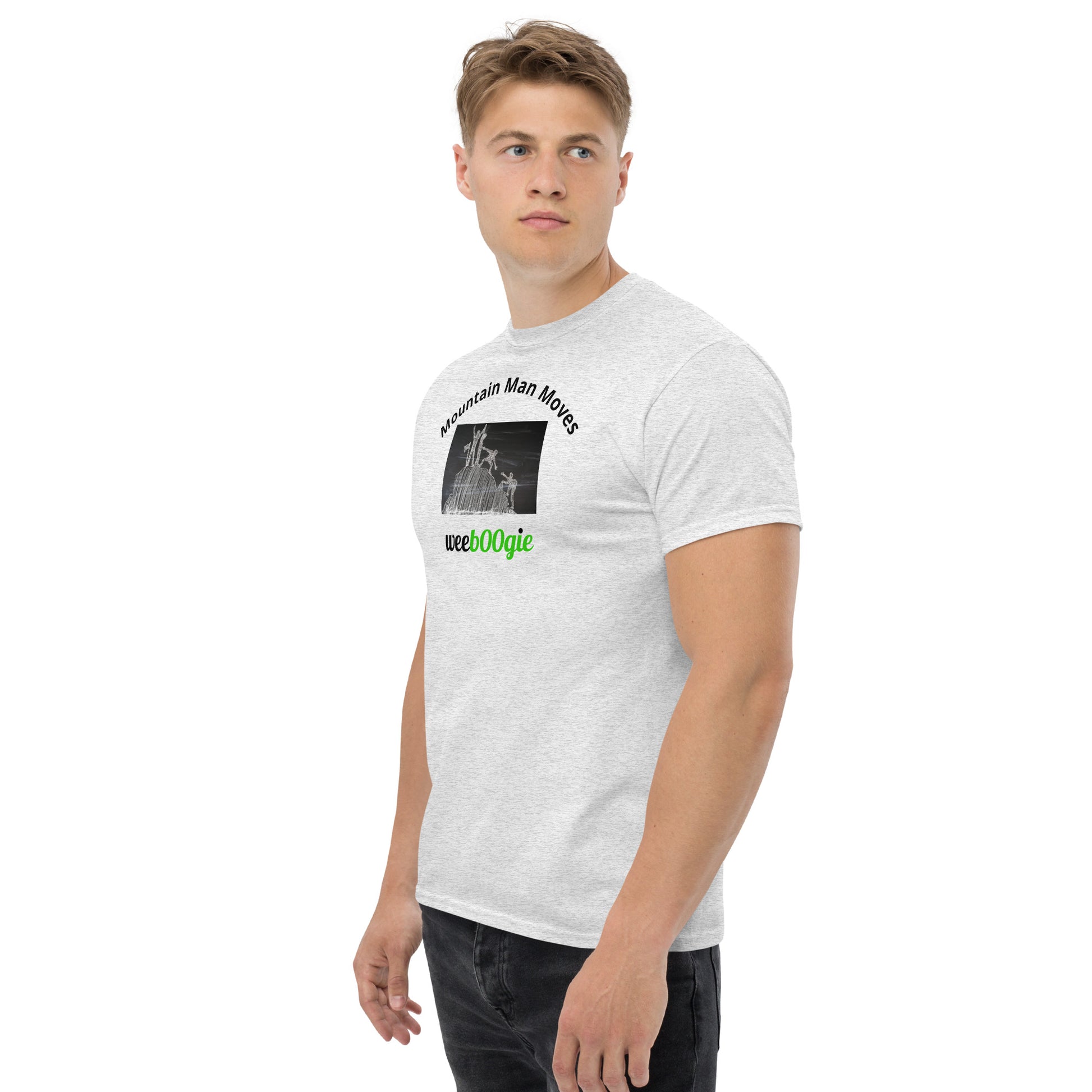 Unisex t-shirt with 'Mountain Man Moves' slogan, styled for outdoor adventures and dance challenges – set against a bold, mountainous backdrop.