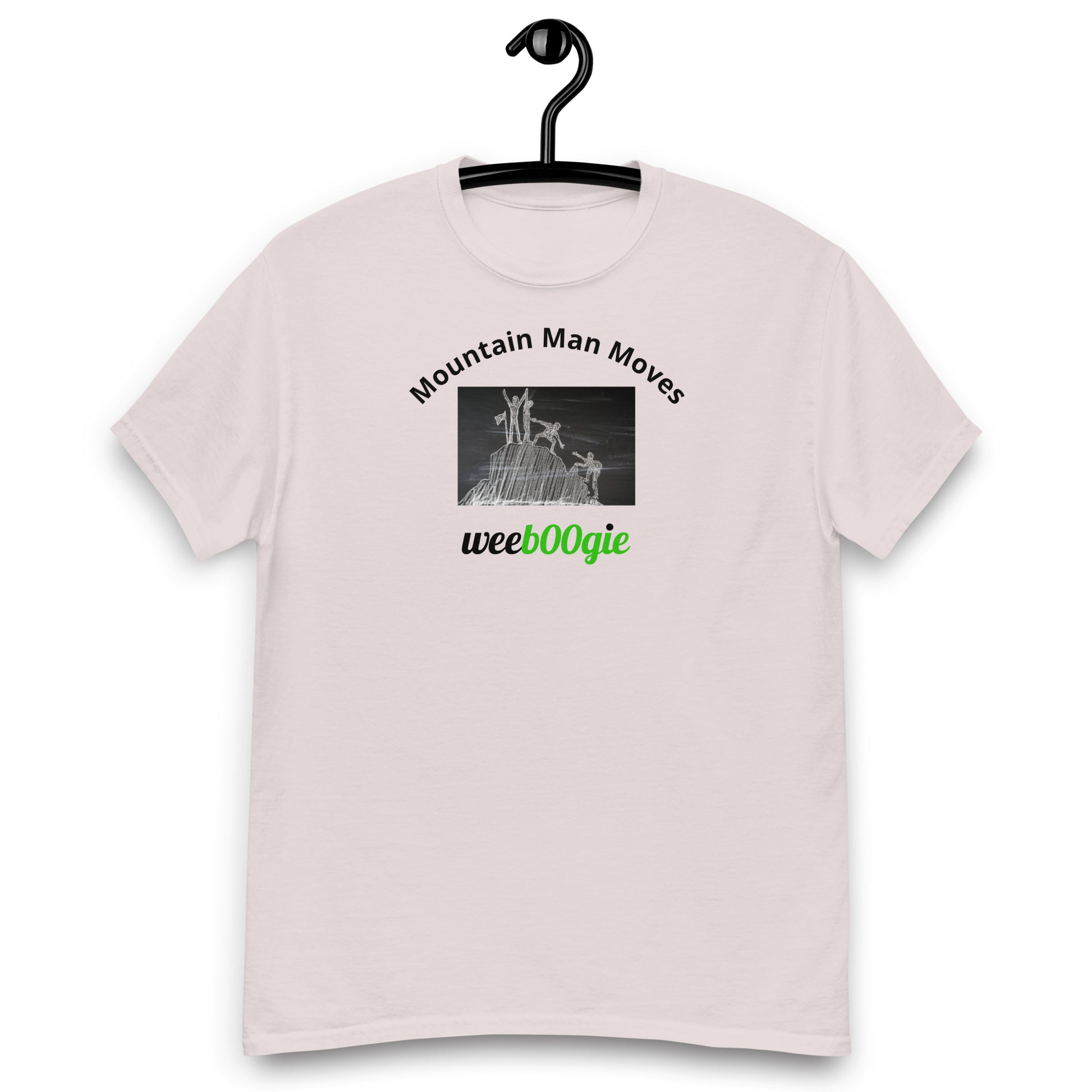 Unisex t-shirt with 'Mountain Man Moves' slogan, styled for outdoor adventures and dance challenges – set against a bold, mountainous backdrop.