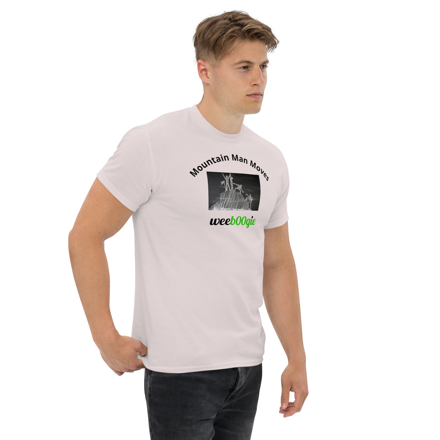 Unisex t-shirt with 'Mountain Man Moves' slogan, styled for outdoor adventures and dance challenges – set against a bold, mountainous backdrop.
