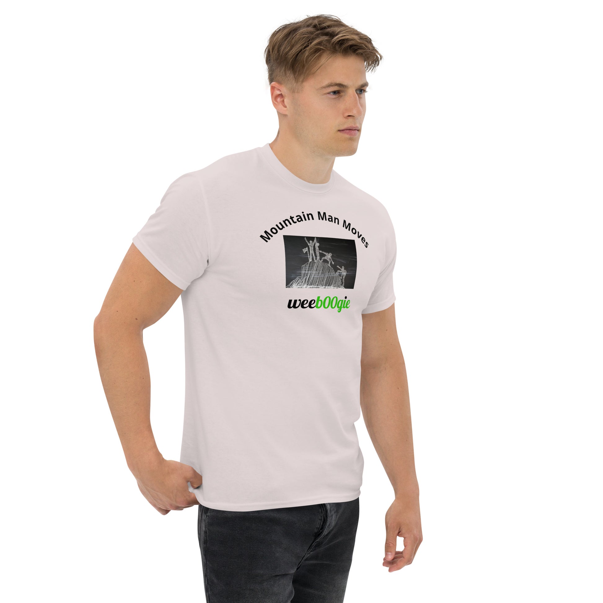 Unisex t-shirt with 'Mountain Man Moves' slogan, styled for outdoor adventures and dance challenges – set against a bold, mountainous backdrop.