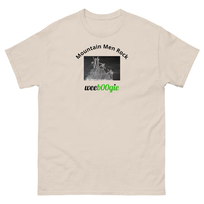 Unisex t-shirt with 'Mountain Men Rock' slogan, styled for outdoor adventures and dance challenges – set against a bold, mountainous backdrop.