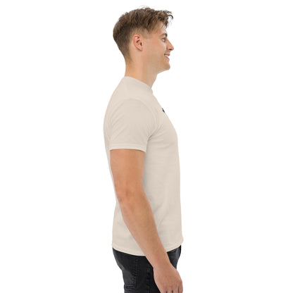 Unisex t-shirt with 'Mountain Man Moves' slogan, styled for outdoor adventures and dance challenges – set against a bold, mountainous backdrop.