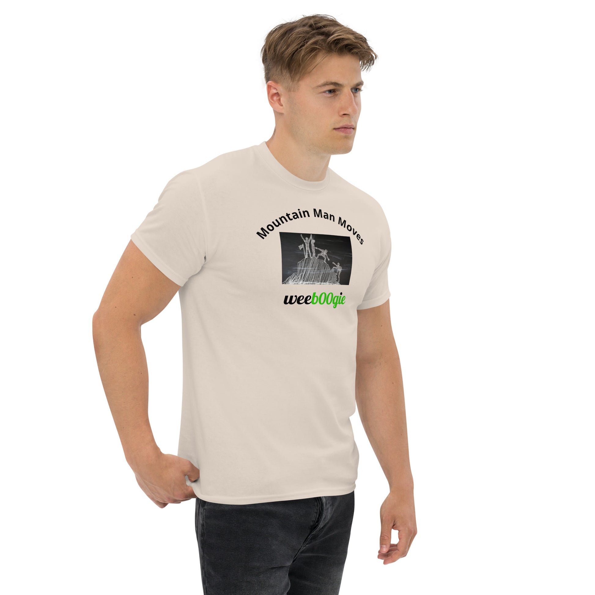 Unisex t-shirt with 'Mountain Man Moves' slogan, styled for outdoor adventures and dance challenges – set against a bold, mountainous backdrop.