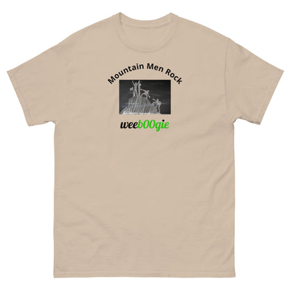 Unisex t-shirt with 'Mountain Men Rock' slogan, styled for outdoor adventures and dance challenges – set against a bold, mountainous backdrop.