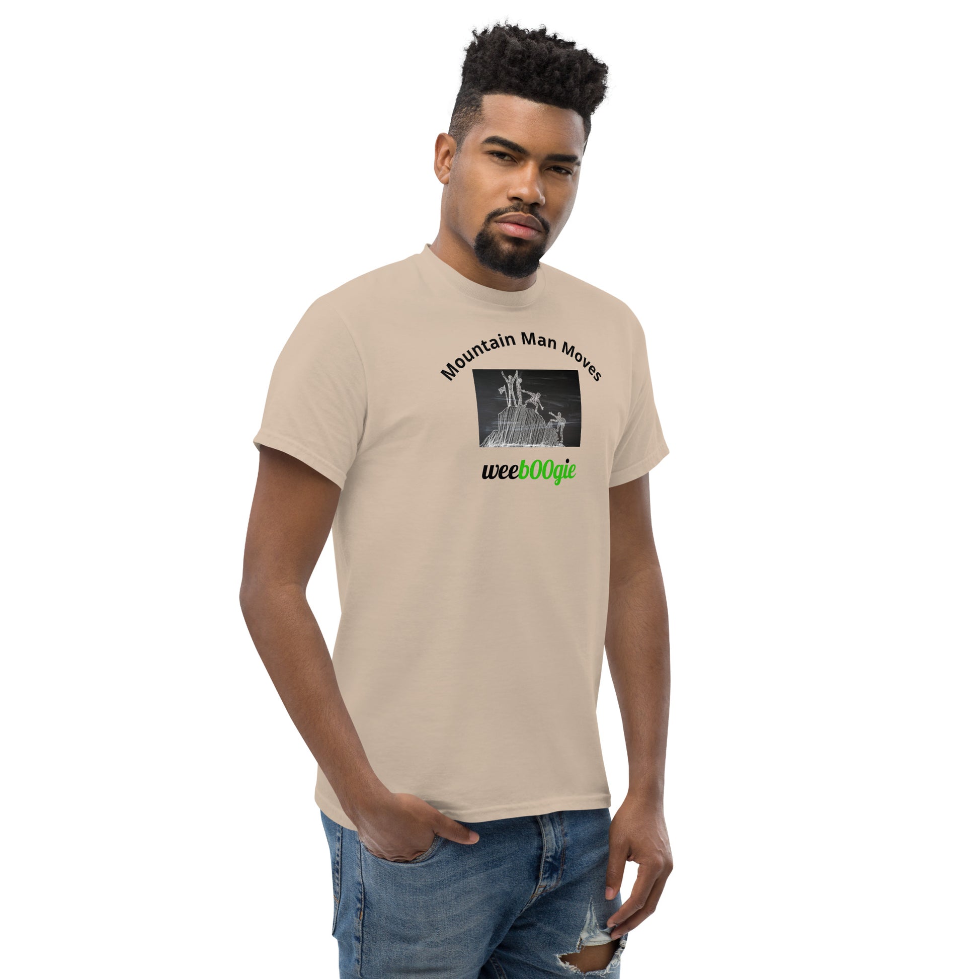 Unisex t-shirt with 'Mountain Man Moves' slogan, styled for outdoor adventures and dance challenges – set against a bold, mountainous backdrop.