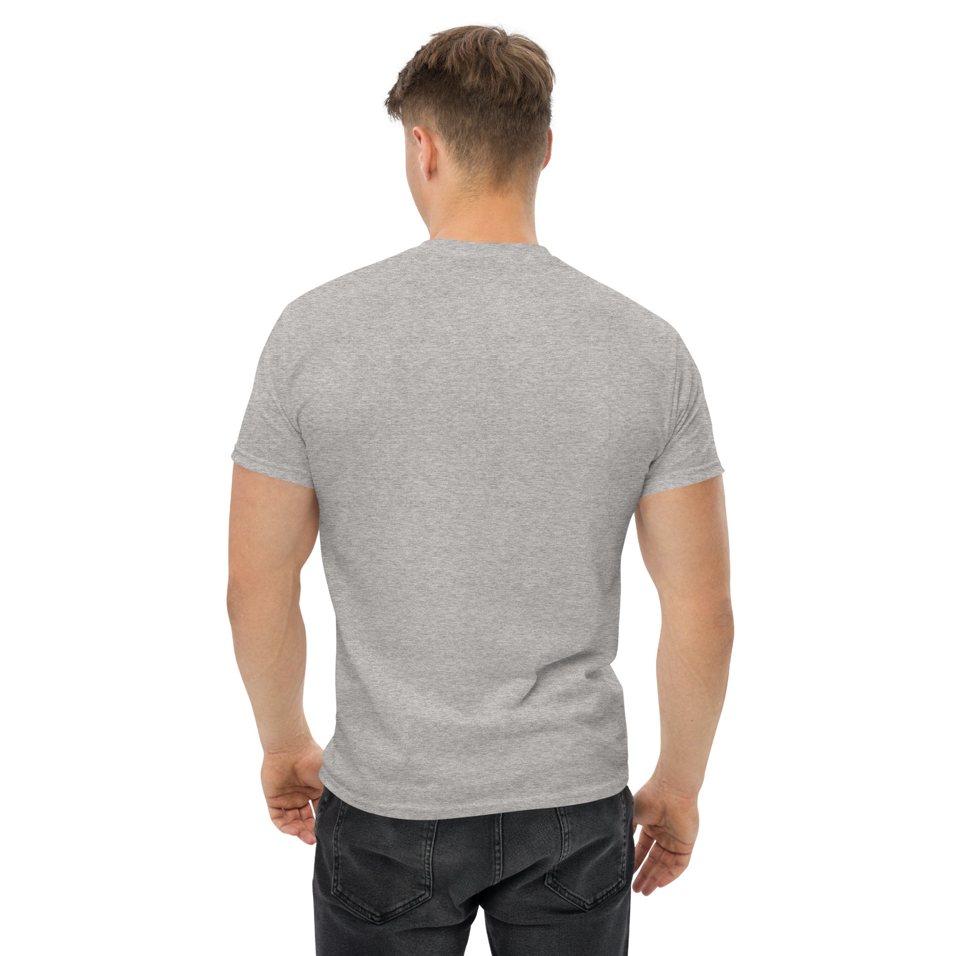 Unisex t-shirt with 'Mountain Man Moves' slogan, styled for outdoor adventures and dance challenges – set against a bold, mountainous backdrop.