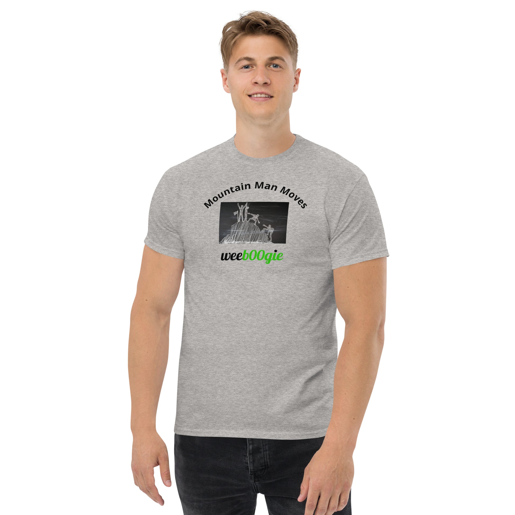 Unisex t-shirt with 'Mountain Man Moves' slogan, styled for outdoor adventures and dance challenges – set against a bold, mountainous backdrop.