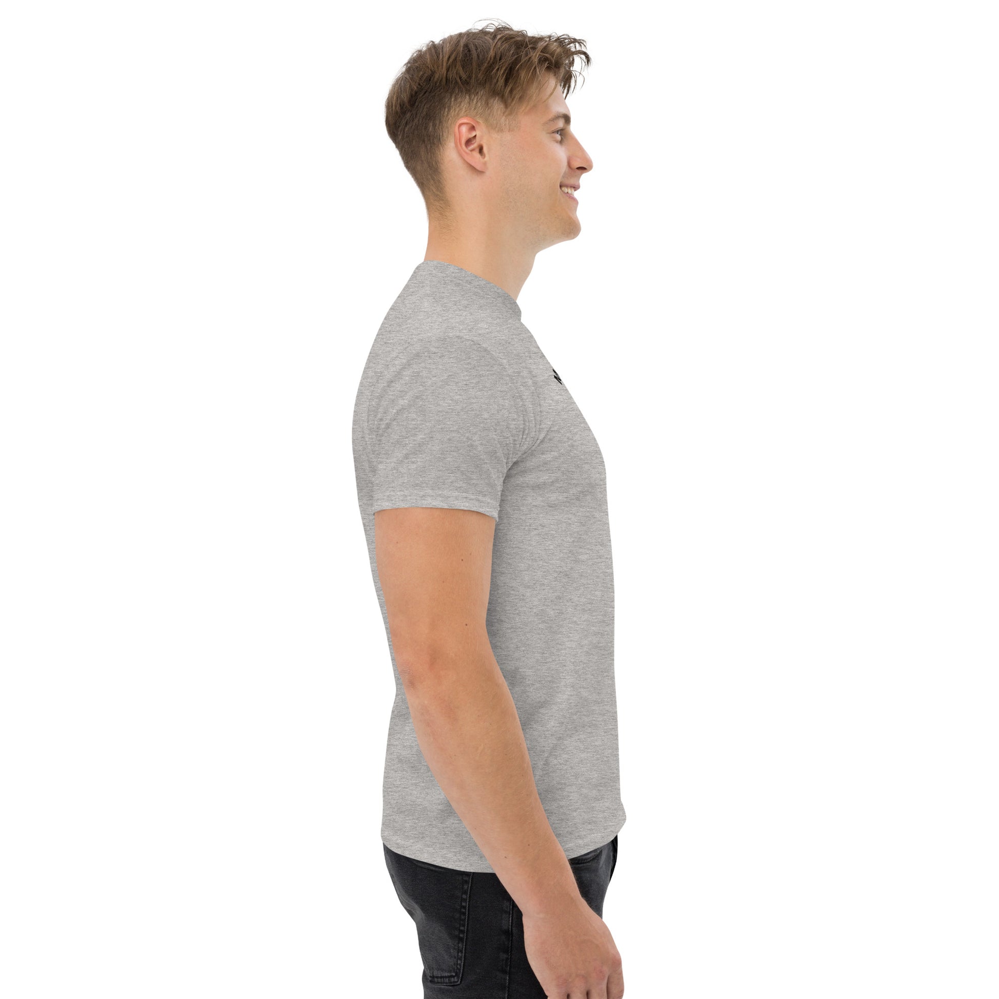 Unisex t-shirt with 'Mountain Man Moves' slogan, styled for outdoor adventures and dance challenges – set against a bold, mountainous backdrop.