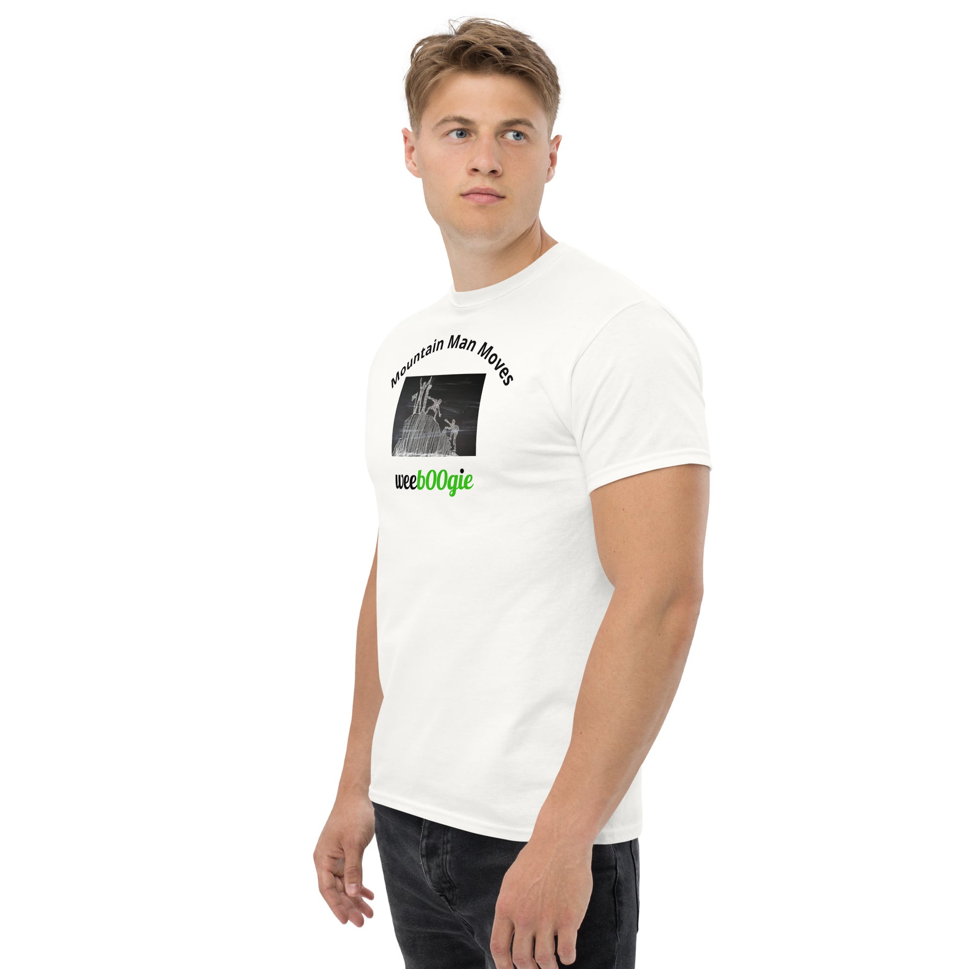 Unisex t-shirt with 'Mountain Man Moves' slogan, styled for outdoor adventures and dance challenges – set against a bold, mountainous backdrop.
