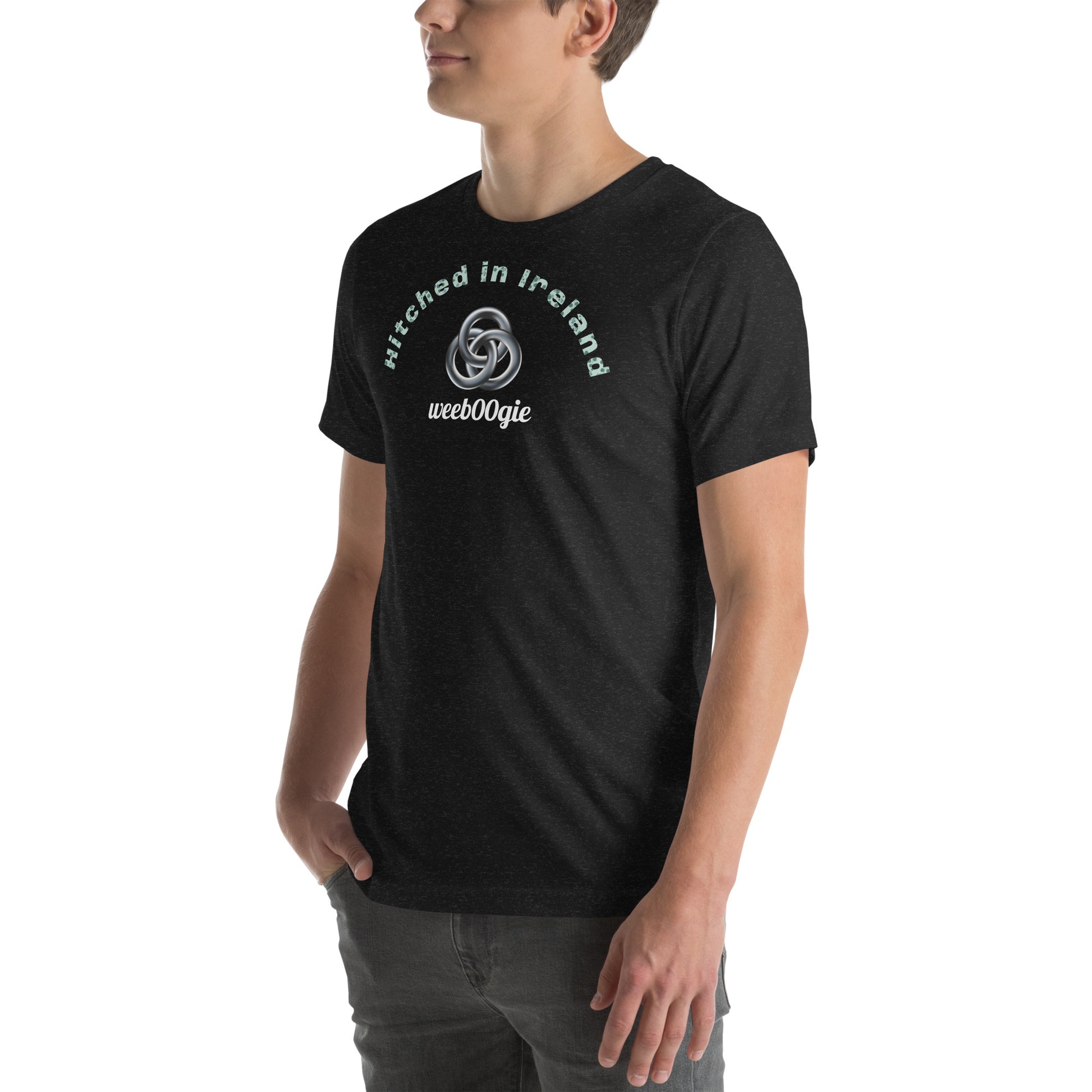 Unisex Staple T-Shirt in Black Heather with 'Hitched in Ireland' Design and wee b00gie Logo - 100% Airlume Combed Ring-Spun Cotton with Side-Seamed Construction - Classic Fit with Shoulder-to-Shoulder Taping - Perfect for Those Just Married in Ireland - Dance Around Our Beautiful Island on Your Honeymoon - wee b00gie store