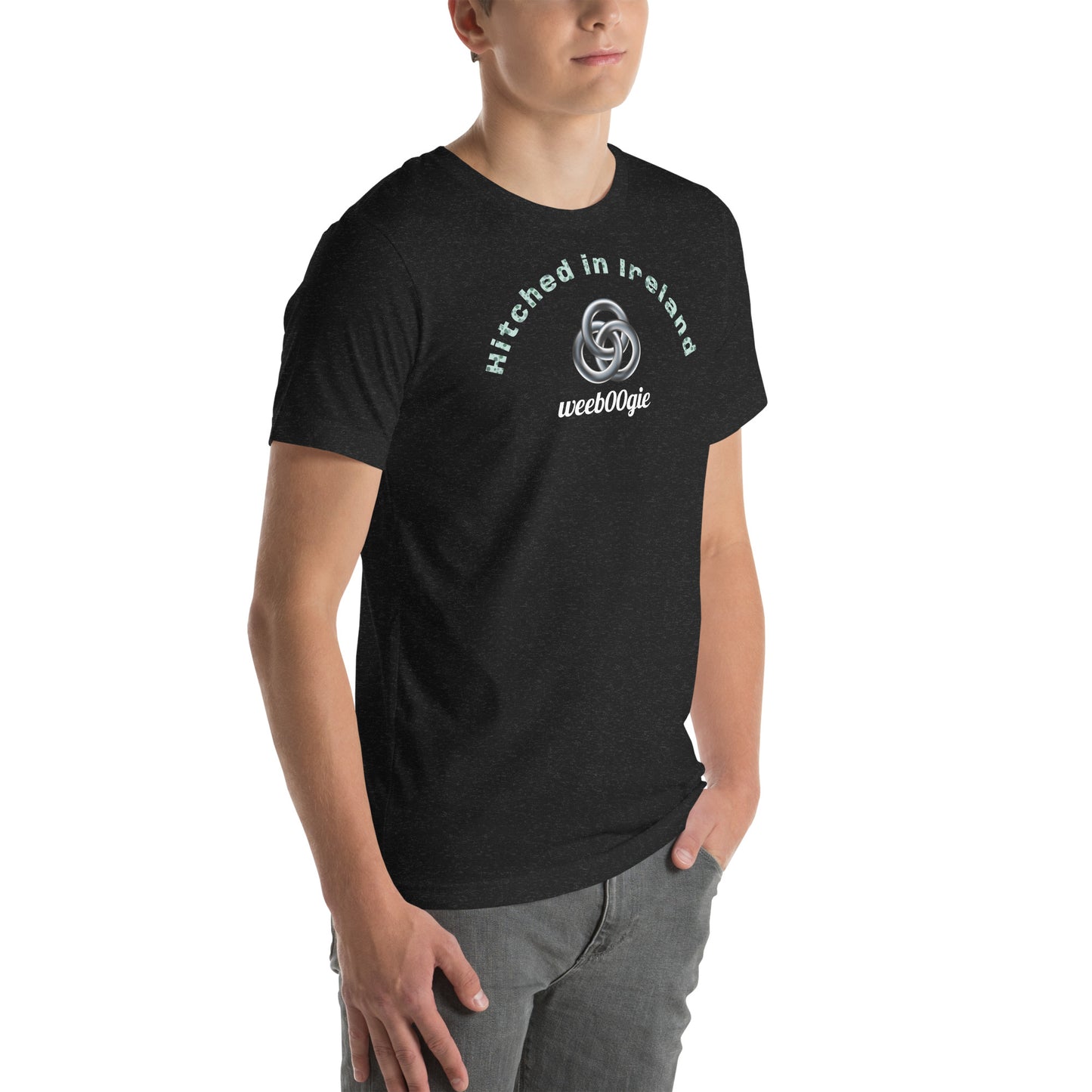 Unisex Staple T-Shirt in Black Heather with 'Hitched in Ireland' Design and wee b00gie Logo - 100% Airlume Combed Ring-Spun Cotton with Side-Seamed Construction - Classic Fit with Shoulder-to-Shoulder Taping - Perfect for Those Just Married in Ireland - Dance Around Our Beautiful Island on Your Honeymoon - wee b00gie store